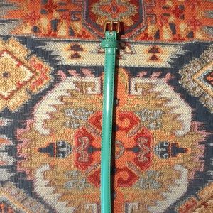 Faux patent leather skinny belt. Size small.